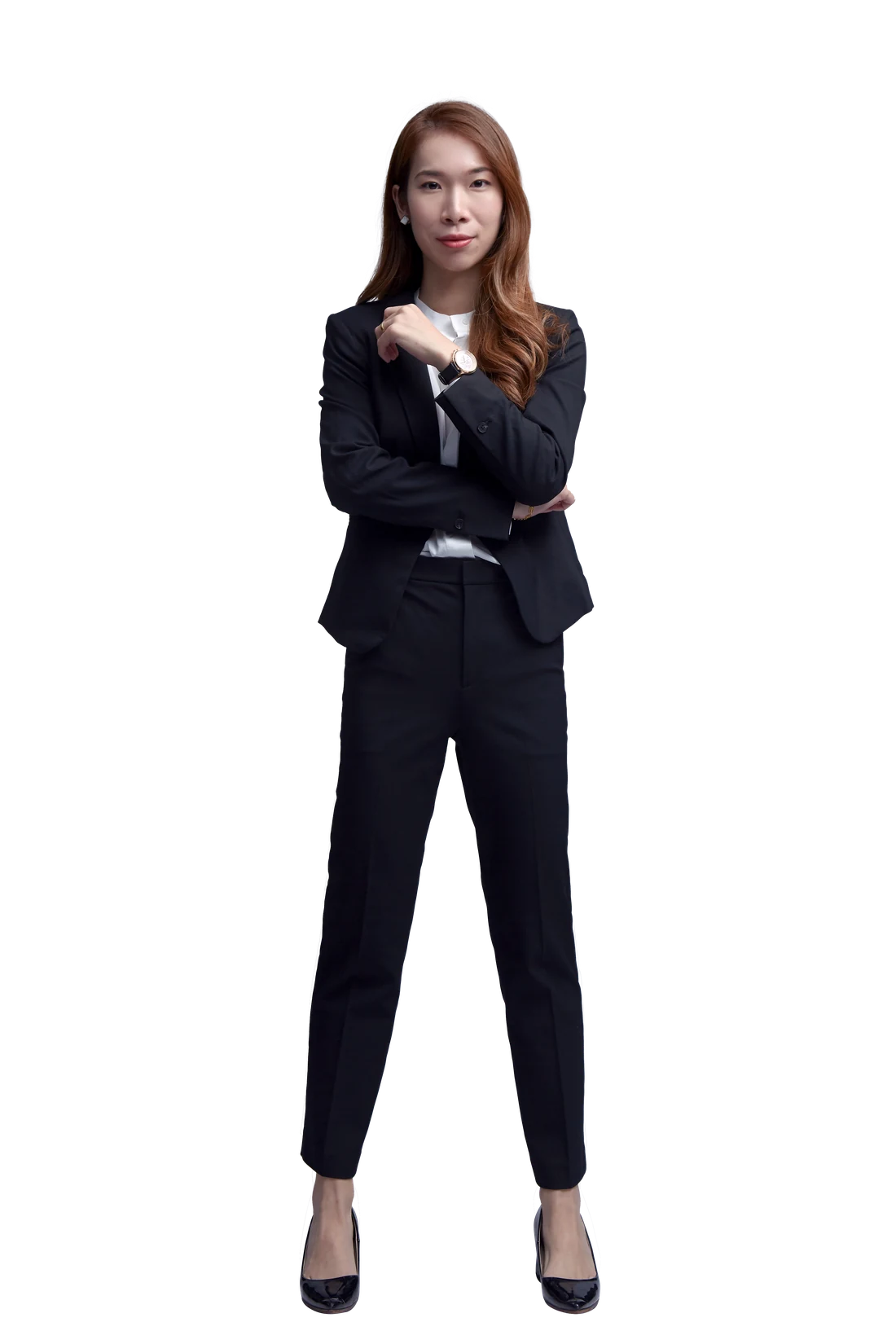 Evon Chong, real estate negotiator, standing in a black suit
