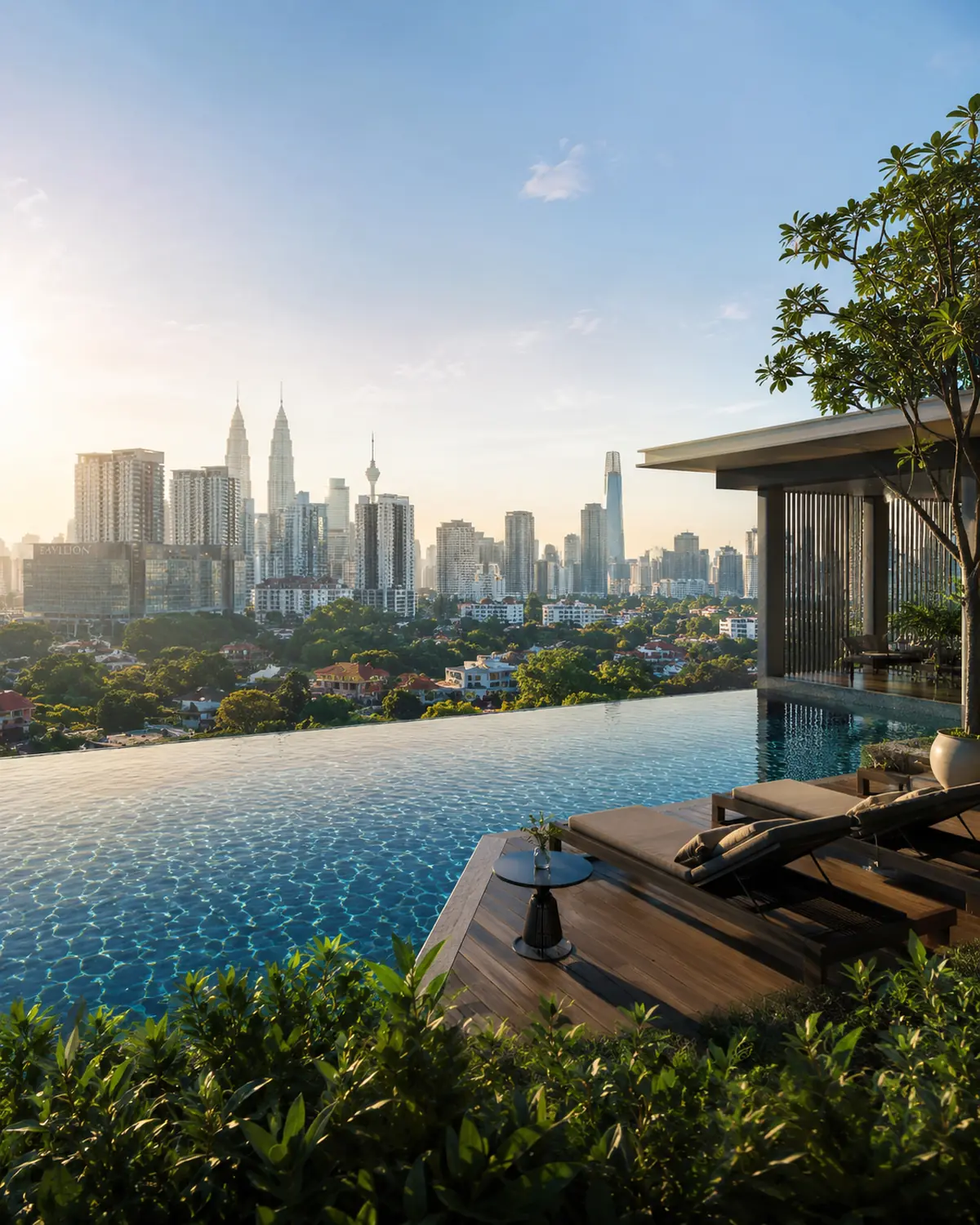 A residence pool deck overlooking the Kuala Lumpur skyline at golden hour